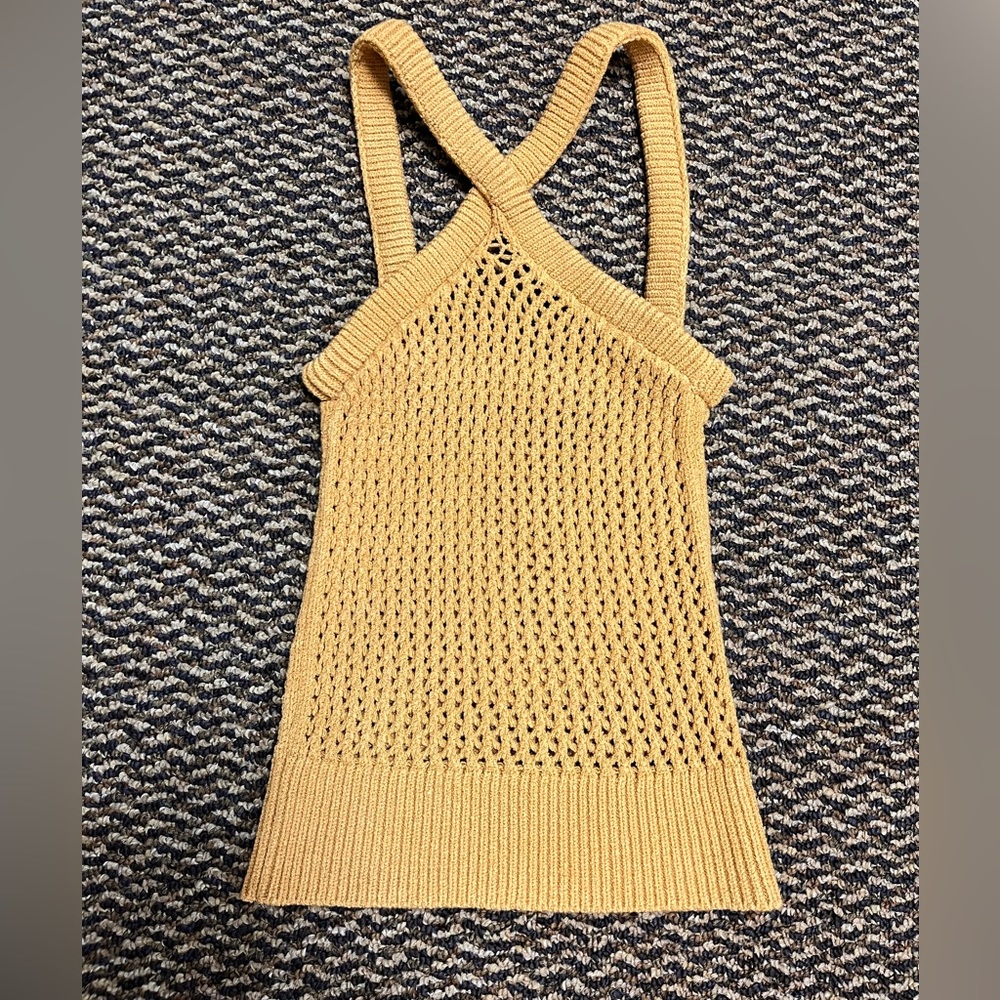 Brand: Isa Boulder
Handcrafted sleeveless open knit tank top in
yellow.